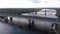 Aerial view of busy traffic on the double road bridge over the river and the railway bridge on the outskirts of the city