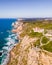 Aerial view of Cabo da Roca lighthouse with majestic coastline looking the Atlantic Ocean, a famous landmark in Colares, Lisbon,