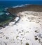 Aerial view of the Caleta del MojÃ³n Blanco, sandy desert beach and rugged coastline. Lanzarote, Spain. Africa