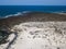 Aerial view of the Caleta del MojÃ³n Blanco, sandy desert beach and rugged coastline. Lanzarote, Spain. Africa