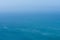 Aerial view of calm infinite ocean and blue sky