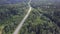 Aerial view camera from green forest of dense mixed tree tops of pine trees and birches. Clip. Aerial view flying over