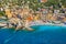 Aerial view of Camogli. Colorful buildings near the ligurian sea. View from above on the public beach with azure and clean water