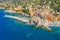 Aerial view of Camogli. Panorama of Castle della Dragonara and Basilica Santa Maria Assunta. Colorful buildings near the