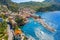 Aerial view of Camogli. Panorama of Castle della Dragonara and Basilica Santa Maria Assunta. Colorful buildings near the ligurian