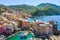 Aerial view of Camogli. Panorama of Castle della Dragonara and Basilica Santa Maria Assunta. Colorful buildings near the ligurian