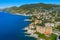 Aerial view of Camogli. Rock coast of Ligurian sea. View from above on boats and yachts. Panorama of the seaside with blue water