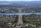 The Aerial view of Canberra from the top of mountain, the image shows the Parliament House and Australian War Memorial.