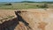 Aerial view of canyons in large sand quarry, sand extraction for construction industry. Drone flies over quarry for