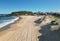 Aerial view captures a tranquil beach scene with the calming sight of gentle waves