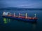 Aerial view cargo bulk carrier ship on the sea at night