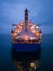 Aerial view cargo bulk carrier ship on the sea at night