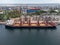 Aerial view of a cargo terminal for unloading grain cargo and containers by shore cranes