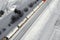 Aerial view of cargo train tank wagons, a double-track railway. Winter rail road with white snow, top view