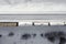 Aerial view of cargo train tank wagons, a double-track railway. Winter rail road with white snow, top view