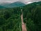 aerial view of carpathian mountains overcast weather suv car on trail road