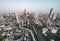 Aerial view of cars and train driving on trident road at Sathorn, Taksin bridge in Bangkok Downtown, Thailand. Financial district