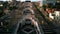 Aerial view of the Cascade Monument, evening sun rays, people walking along the