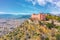 Aerial view castle Cerisdi building on the cliff side of a mountain of Palermo, Italy