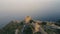 Aerial view of the castle on the hill. Alanya city walls on the hill