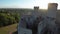 Aerial view on Castle in Ogrodzieniec at sunset. Stone medieval castle built on a rock, made of white stone. Filmed on