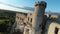 Aerial view on Castle in Ogrodzieniec at sunset. Stone medieval castle built on a rock, made of white stone. Filmed on