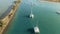 Aerial view of catamarans entering marina on a sunny day. Lefkas, Greece