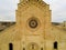 Aerial  View of the Cathedral of St. Maria La Bruna on Cloudy Sky at Sunset. Matera, Italy