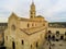 Aerial  View of the Cathedral of St. Maria La Bruna on Cloudy Sky at Sunset. Matera, Italy