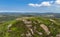 Aerial view of a Celtic Cross on the top of Slemish Mountain Co Antrim Northern Ireland Slemish hill where St Patrick worked as a