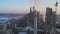 Aerial view of cement plant production area with high concrete factory structure and tower cranes at industrial site