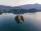 Aerial view of Cerkev Marijinega, a Catholic Church on a small island in the middle of Bled Lake at sunrise, Upper Carniola,