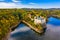 Aerial view chateau Orlik, above Orlik reservoir in beautiful autumn nature. Romantic royal Schwarzenberg castle above water level