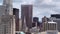 Aerial view of Chicago Loop as military jet soars through clouds