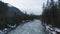 Aerial View of Chilliwack River with snow during winter season.