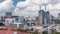 Aerial view of Chinatown with red roofs and Central Business District skyscrapers timelapse, Singapore