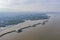 Aerial view of Chon Ra Mak Vi Tee Bridge Road in Sri Racha district with sea, Chonburi skyline, Thailand. Urban city in Asia.