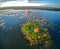 Aerial view of Church of St. Linhart in South Moravia on the island in stunning evening golden hour