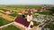 Aerial view. Circle around a nice catholic chapel and a graveyard. Sabaoani village, Neamt county, Romania.