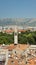 Aerial view of the city from the bell tower, roofs of houses and church in old town, beautiful cityscape, sunny day, Split,
