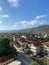 Aerial view of the city with a cloudy blue sky in the background, Pogradec, Albania