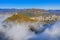 Aerial view of city covered by fog