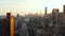 Aerial view of city development. multistorey houses and wide long streets. Downtown skyscrapers in distance. Manhattan