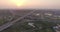 Aerial view of city highway interchange at sunset