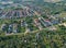 Aerial view on city housing area with many buildings, roads and garden