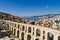 Aerial view the city of Kavala in northern Greek, ancient aqueduct Kamares, homes and medieval city wall