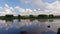 Aerial view of a city lake with a reflection of clouds.