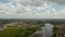 Aerial view of a city lake with a reflection of clouds.