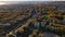 Aerial view of the City, Main Street, Park, Building, Alley, Grassland, Mountains in Sunset, Autumn