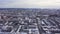 Aerial view of the city and many houses, roads, and yards in the winter time. Clip. Beautiful cityscape with different